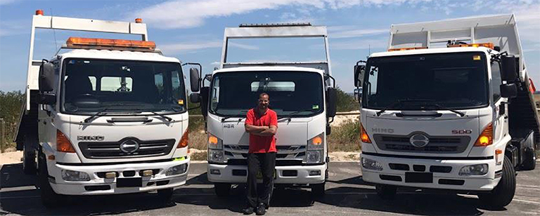 Three tow trucks ready for the road in Sydney.