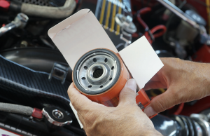 A new replacement car oil filter about to be installed.