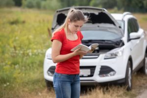 A lady reading through the owners manual.