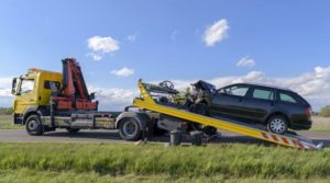 Damaged car being towed.