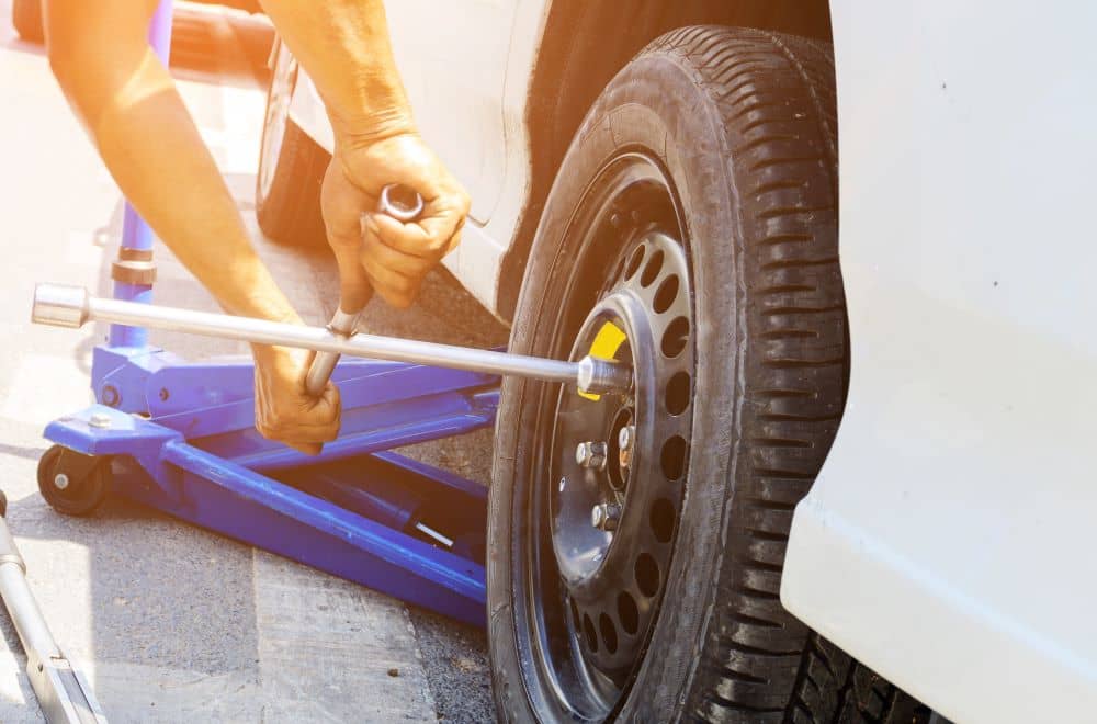 Changing car tyre.