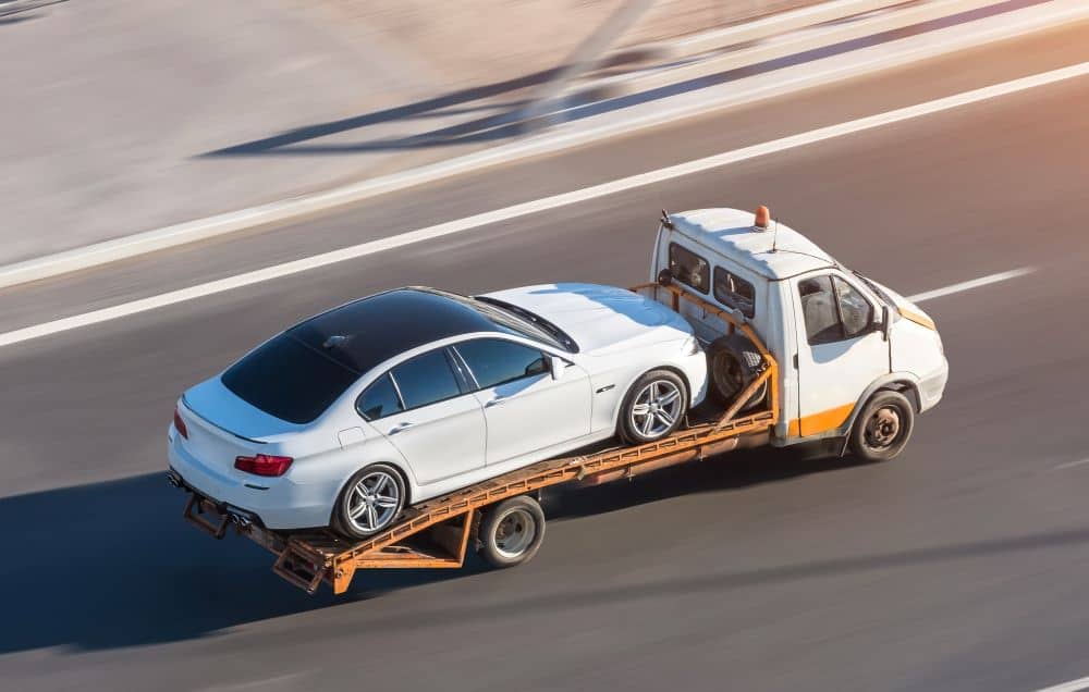 Towing abandoned car.