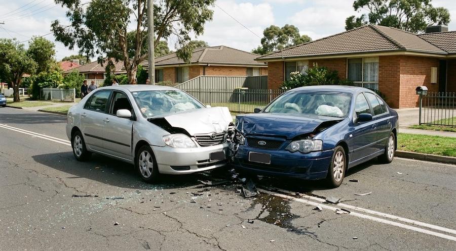 two vehicles involved in suburban car accident awaiting towing in Sydney