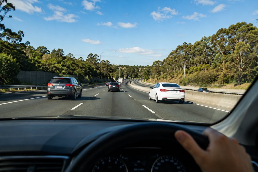 Safe motorway driving on a multi-lane Sydney highway during clear conditions