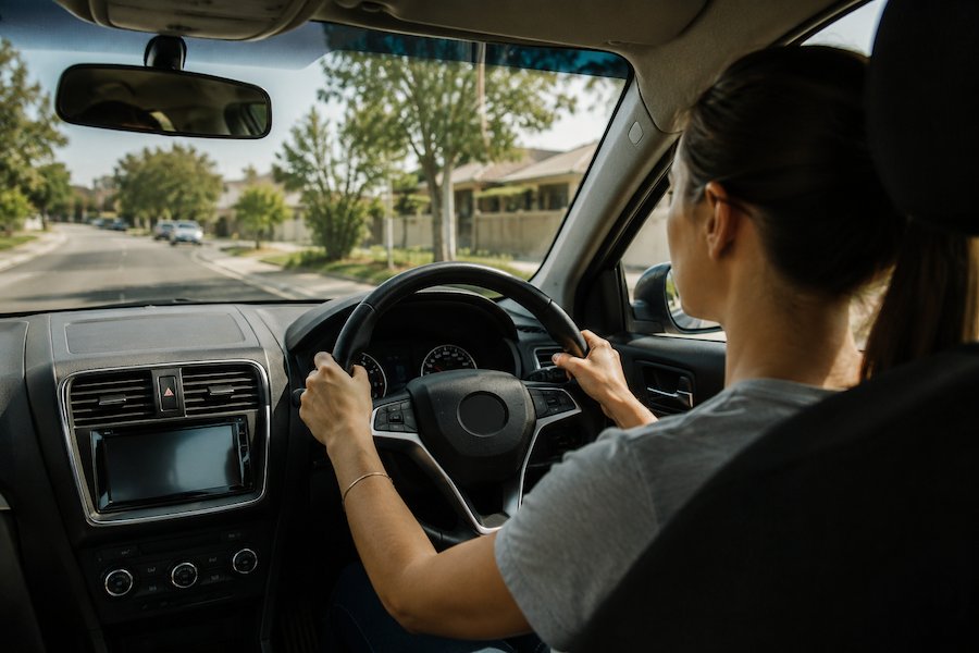 Driver maintaining safe driving position on a suburban Sydney road