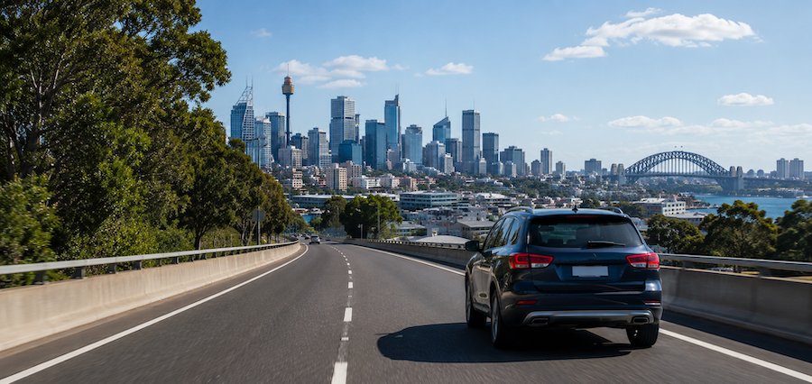 Vehicle travelling towards the Sydney skyline demonstrating safe road use